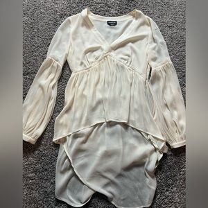 Off white sheer v neck blouse from Bebe